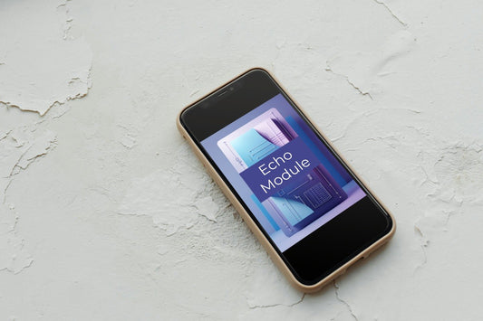 A smartphone with a black front screen and a light beige or gold-toned edge lies diagonally on a textured off-white surface. The screen displays a graphic with the text 'Echo Module'.